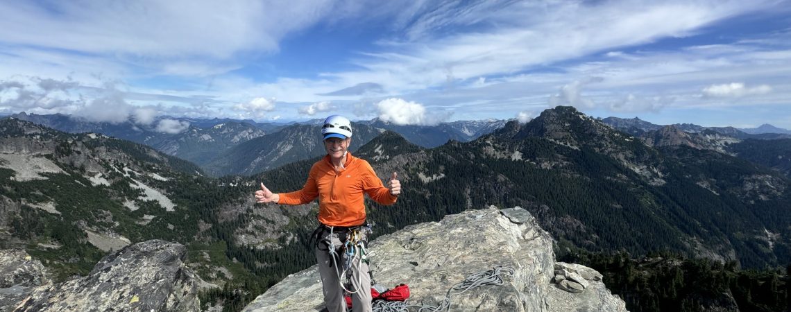 John Yarnall on the Summit of the Tooth after climbing the South Face. Photo by Ian Nicholson
